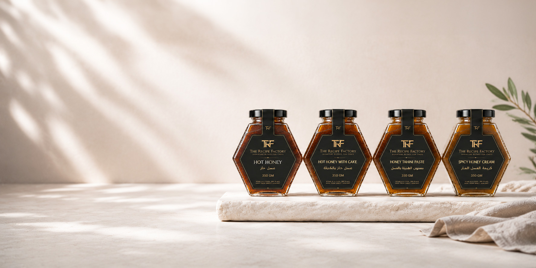 Four TRF signature honey blends on a marble table